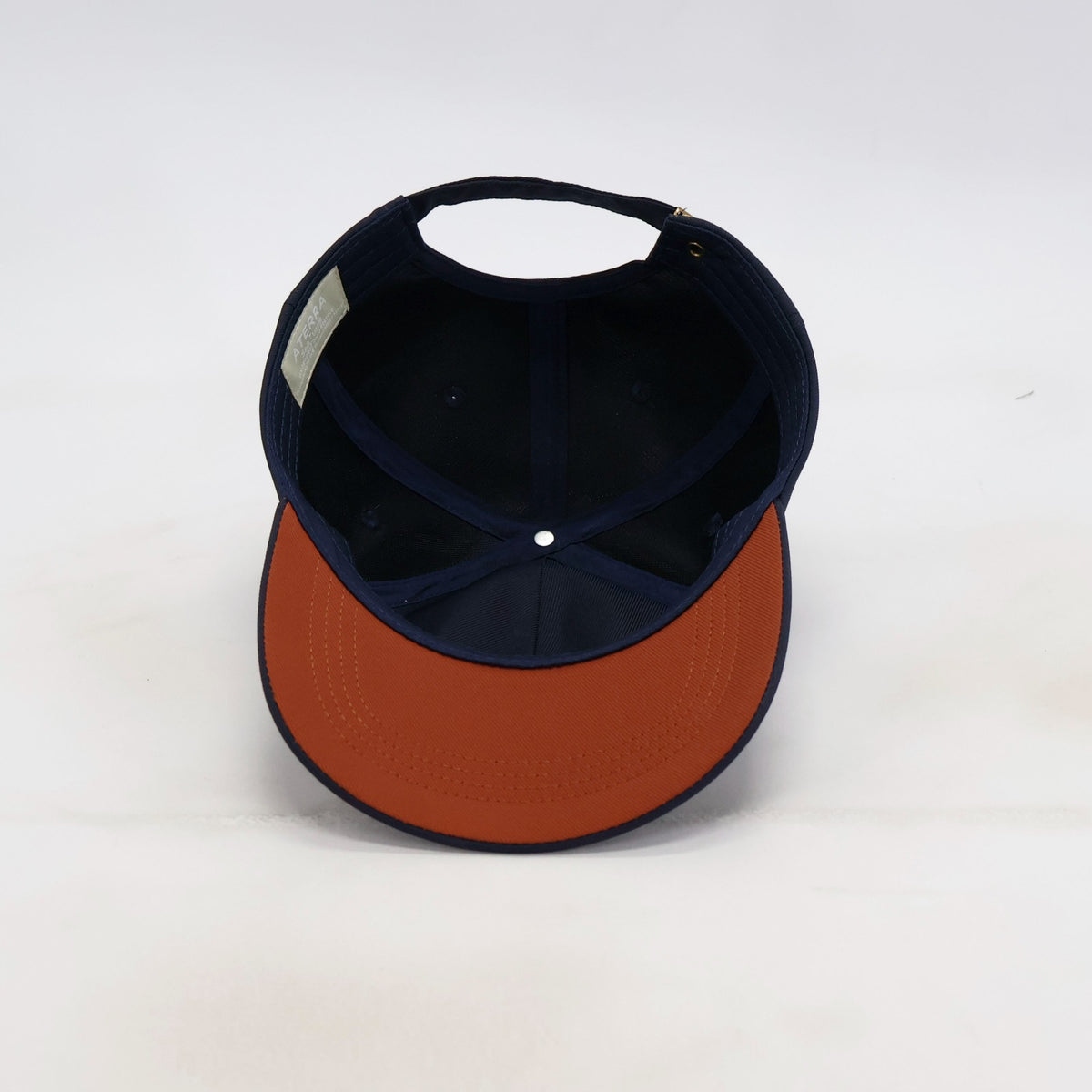 Underside view of the ATERRA Ocean Series cap showing the brim and construction